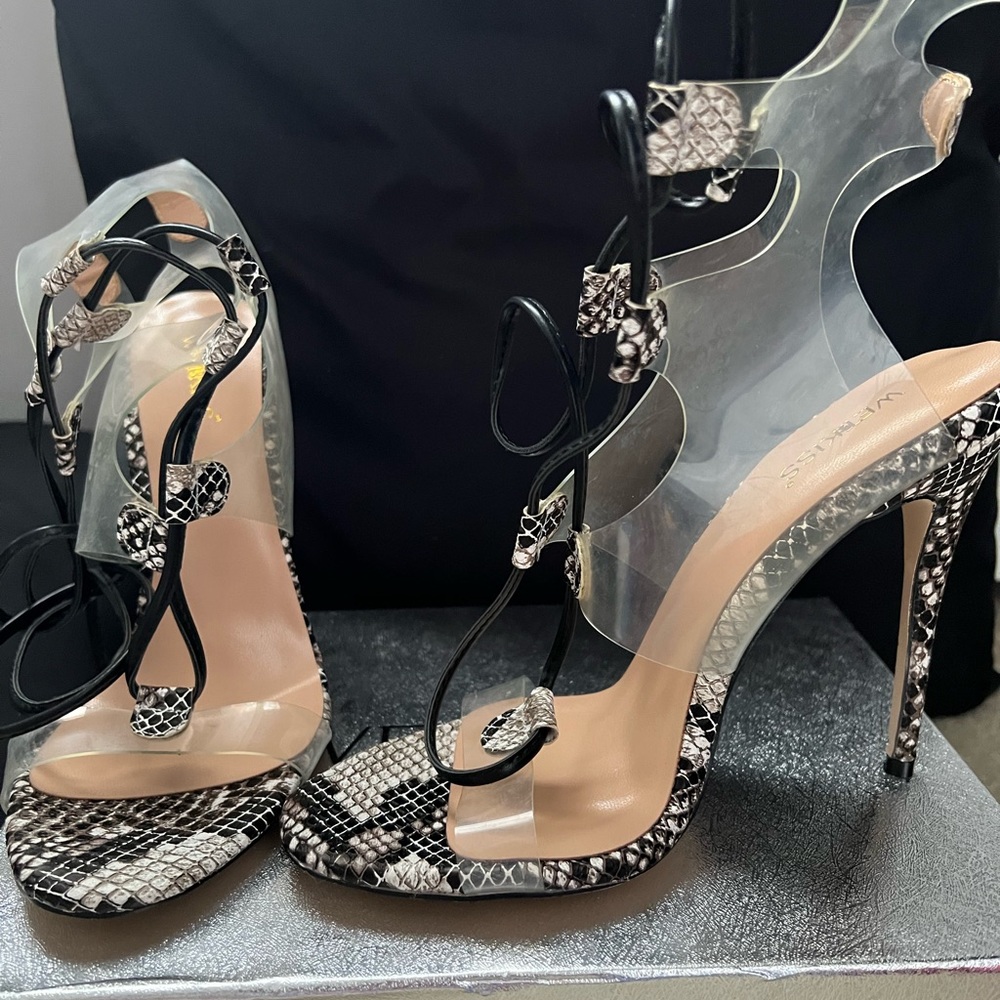 Never worn heels with ankle strap.